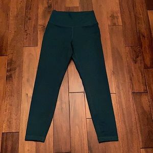 Green tight exercising leggings